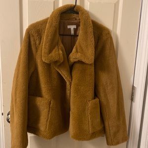Worn once kept in closet. Very comfortable. Faux fur